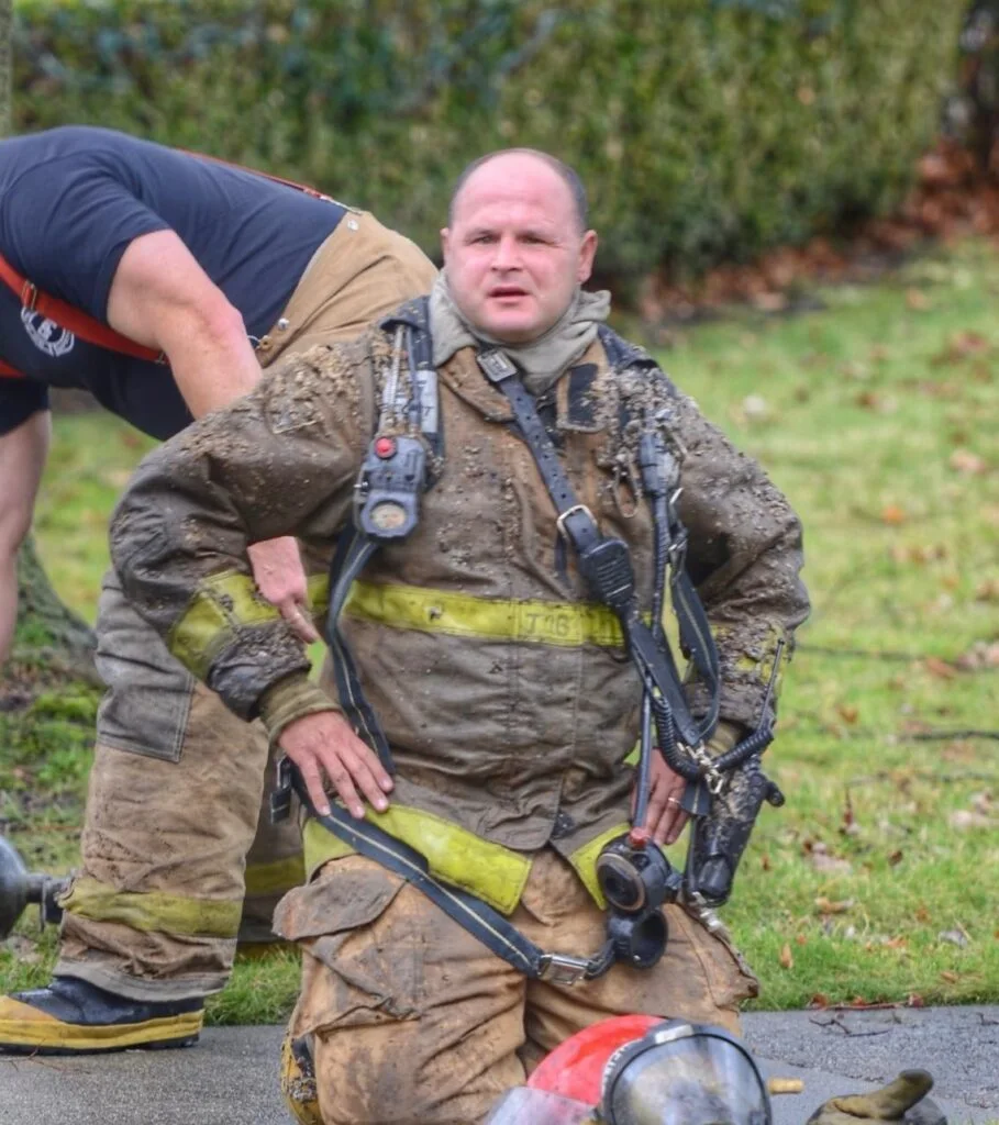 Chief James A. Bostock in turnout gear at a structure fire